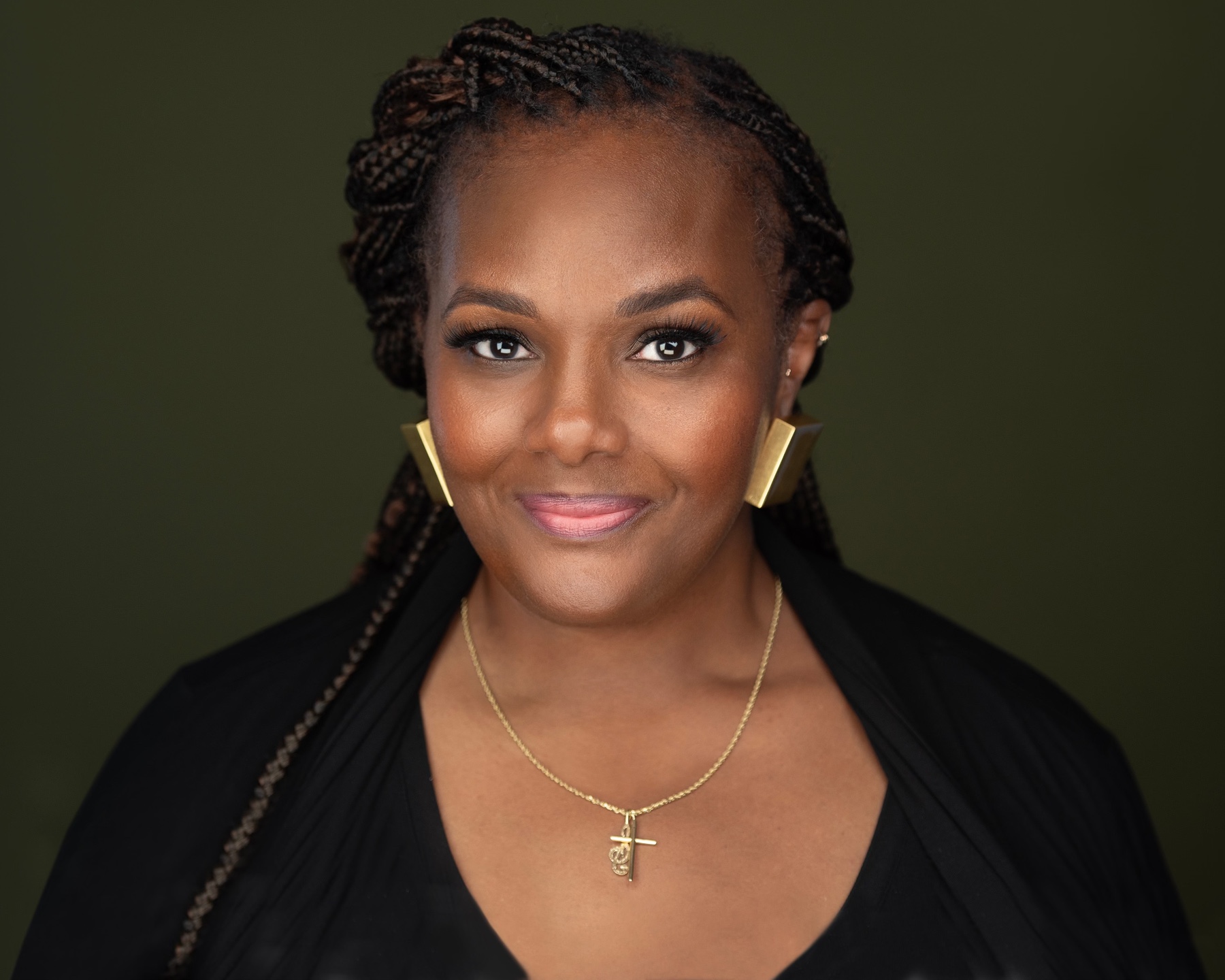 Mezzo-soprano Patrice P. Eaton, photographed against an olive-green background